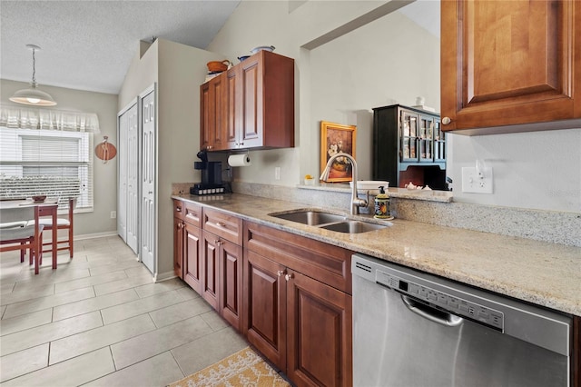 kitchen with dishwasher, sink, hanging light fixtures, vaulted ceiling, and light tile patterned flooring