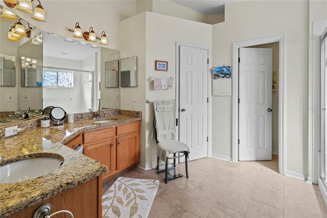 bathroom with tile patterned floors, vanity, and an enclosed shower