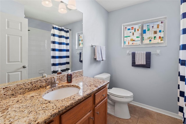 bathroom featuring tile patterned floors, vanity, curtained shower, and toilet