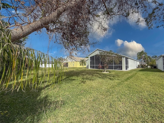 view of yard featuring a sunroom