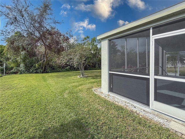 view of yard featuring a sunroom