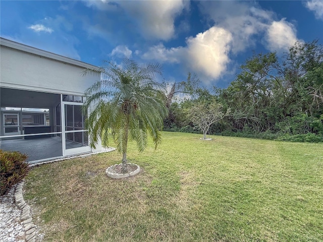 view of yard featuring a sunroom