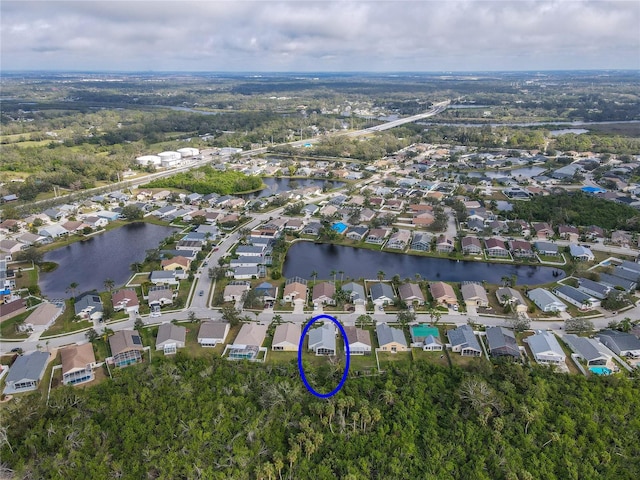 drone / aerial view with a water view