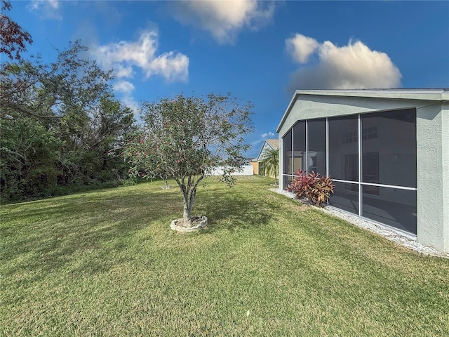 view of yard featuring a sunroom