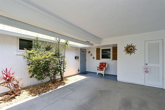 property entrance with a patio area