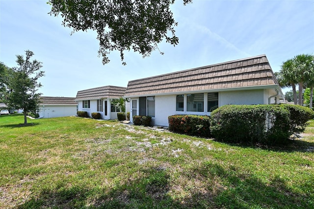 ranch-style house featuring a front lawn