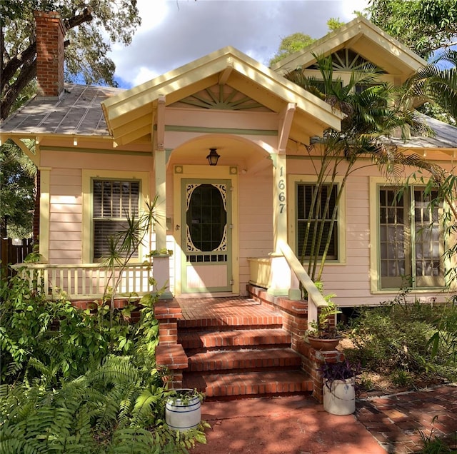 doorway to property with a porch