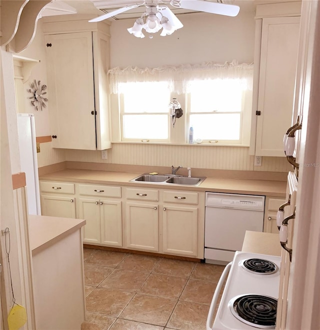 kitchen featuring white appliances, ceiling fan, light tile patterned floors, and sink