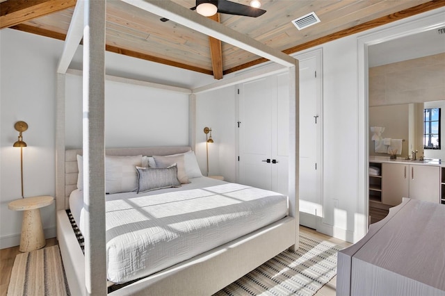 bedroom with beam ceiling, ceiling fan, wood ceiling, and light hardwood / wood-style floors