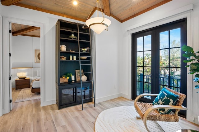 living area with french doors, vaulted ceiling with beams, light hardwood / wood-style flooring, and wood ceiling