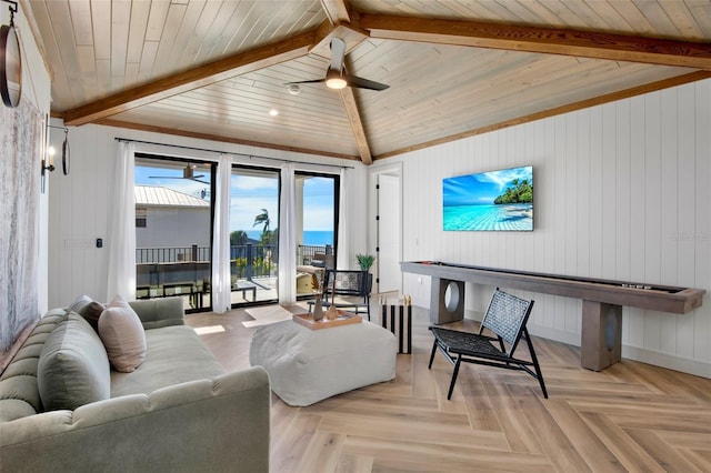 living room with vaulted ceiling with beams, ceiling fan, wood ceiling, and light parquet flooring