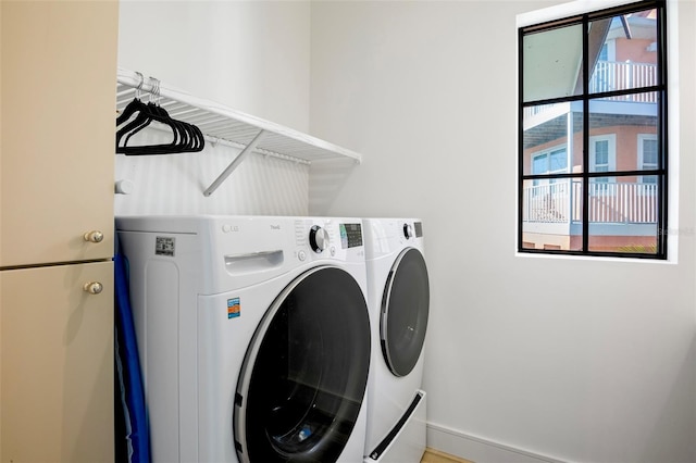 laundry room with washing machine and dryer