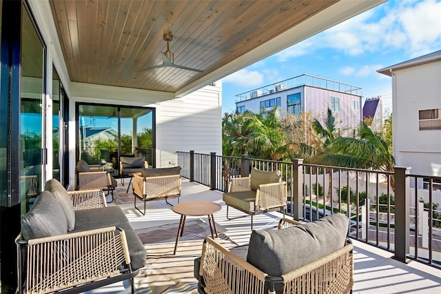 balcony featuring an outdoor hangout area and ceiling fan