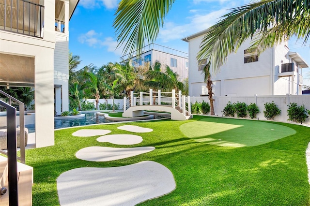 view of yard with a fenced in pool