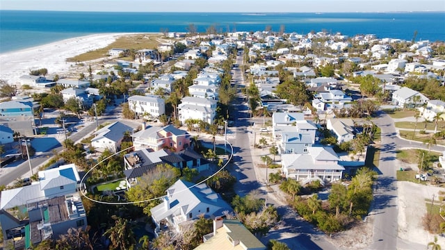 aerial view featuring a water view and a beach view