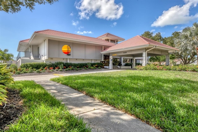 exterior space with a porch and a front lawn