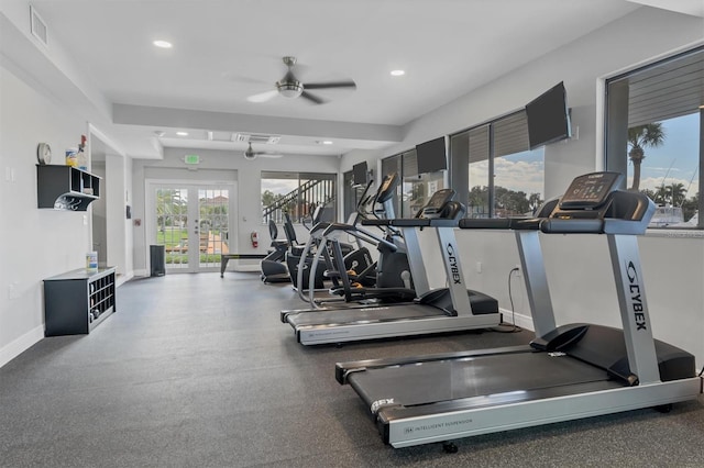 workout area featuring ceiling fan, a wealth of natural light, and french doors