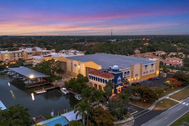 aerial view at dusk with a water view