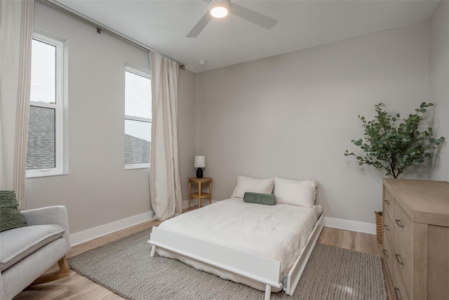 bedroom featuring ceiling fan and light hardwood / wood-style floors