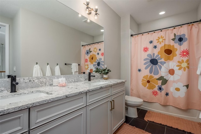 full bathroom with toilet, vanity, tile patterned flooring, and shower / bath combination with curtain