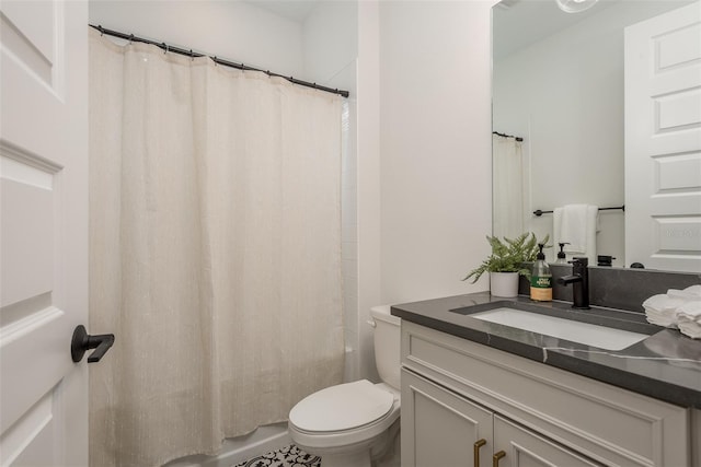 full bathroom featuring toilet, vanity, and shower / tub combo with curtain