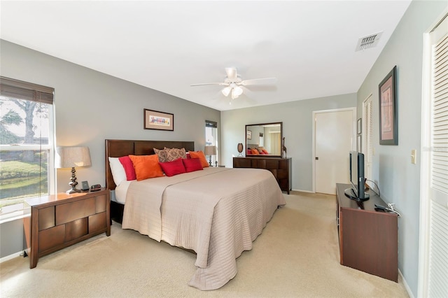 carpeted bedroom with ceiling fan