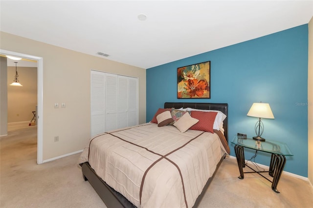 carpeted bedroom with a closet