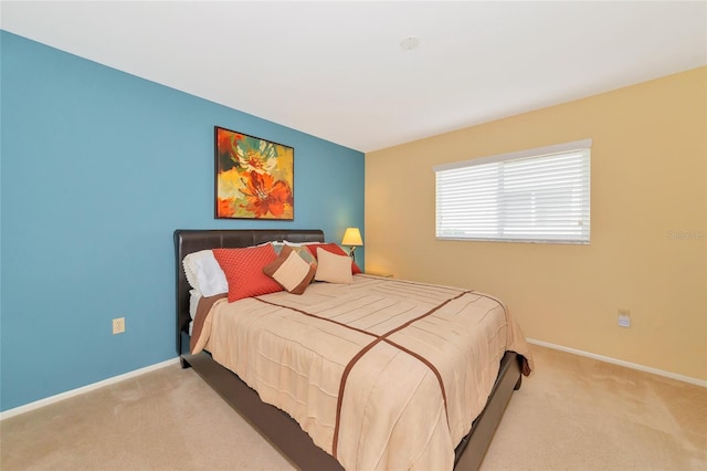 bedroom with light colored carpet