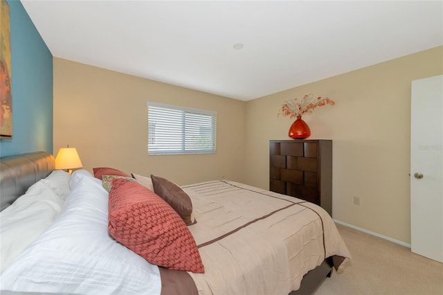 bedroom with light colored carpet