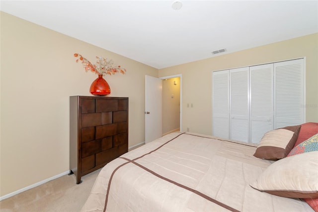 carpeted bedroom with a closet