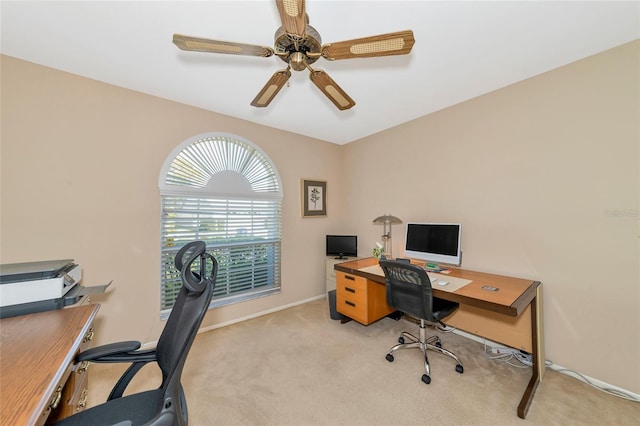 carpeted home office with ceiling fan