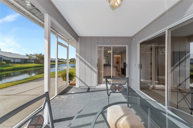 sunroom with a water view