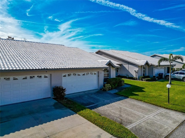 single story home with a garage and a front yard