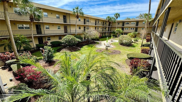 view of home's community with a lawn