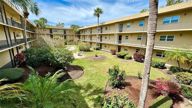 view of community featuring a lawn