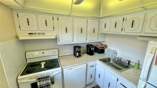 kitchen with white cabinetry, white appliances, range hood, and sink