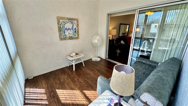 11485 Oakhurst Rd Unit 200-220, Largo, FL 33774 - living room with a textured wall and wood finished floors