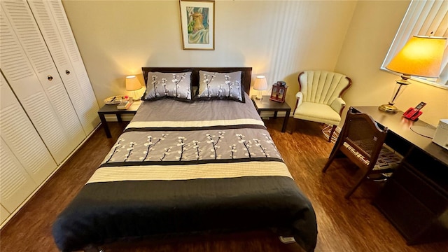 bedroom with a closet and dark wood-type flooring