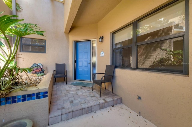 entrance to property with a patio