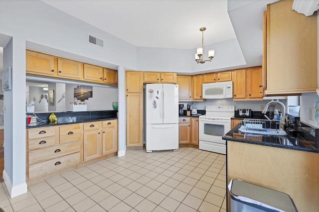 kitchen featuring white appliances, sink, pendant lighting, light tile patterned floors, and an inviting chandelier