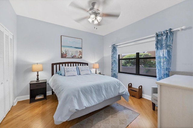 bedroom featuring light wood-type flooring, a closet, and ceiling fan