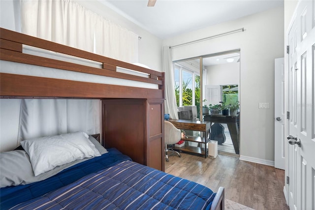 bedroom with a closet, ceiling fan, and light wood-type flooring