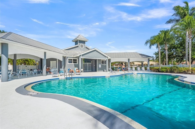 view of swimming pool featuring a patio