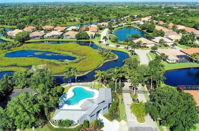 birds eye view of property featuring a water view