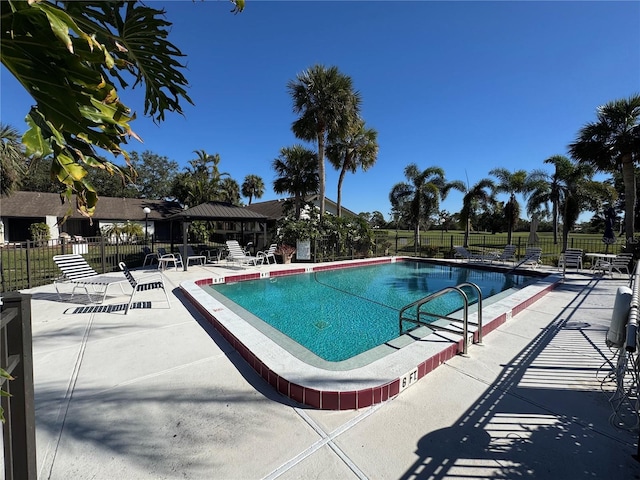 view of swimming pool featuring a gazebo and a patio