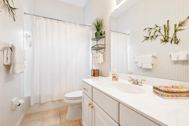 full bathroom with toilet, shower / bath combo, vanity, and tile patterned floors