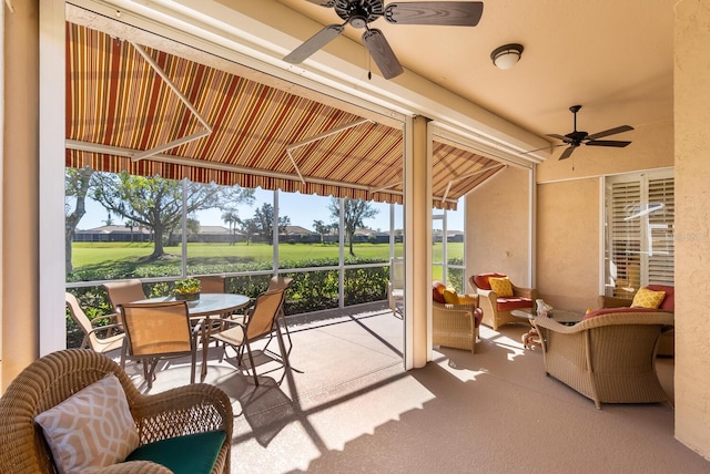 sunroom / solarium with ceiling fan