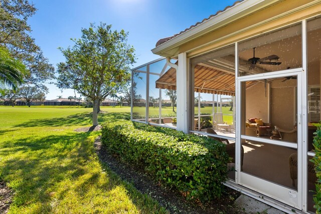 view of yard featuring a lanai