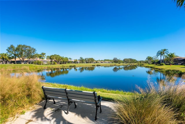 surrounding community featuring a water view