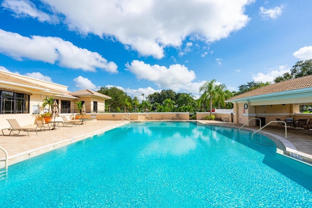 view of pool featuring a patio